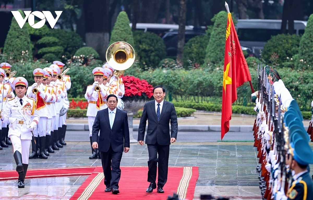 lao pm sonexay siphandone warmly welcomed in hanoi on official visit picture 2